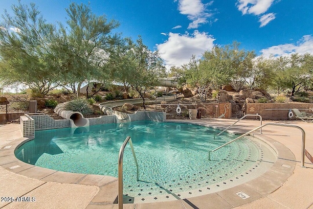 31221 N 130th Ln, Peoria, AZ 85383 - community pool featuring a water slide and a patio area