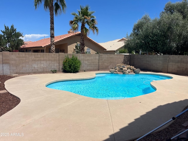 view of pool with a fenced in pool, a fenced backyard, and a patio area