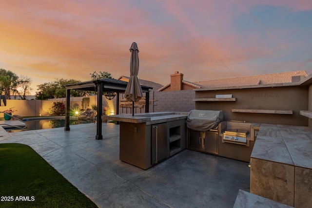 view of patio featuring a gazebo, a fenced in pool, area for grilling, and a fenced backyard