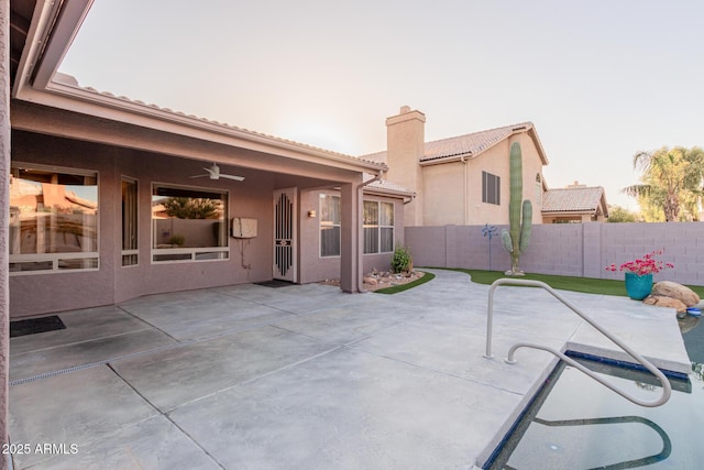 view of patio / terrace with a fenced backyard and a ceiling fan