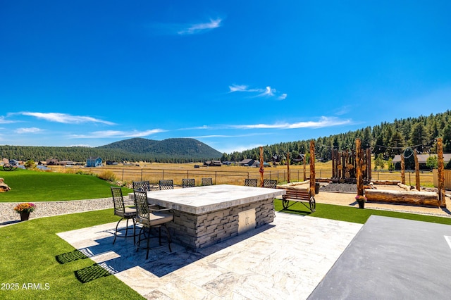 view of patio featuring a mountain view and an outdoor bar