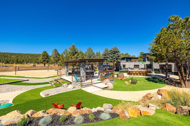 view of home's community featuring a bar, a pergola, a lawn, and volleyball court