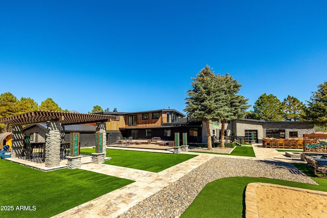 view of yard with exterior bar, a patio area, and a pergola