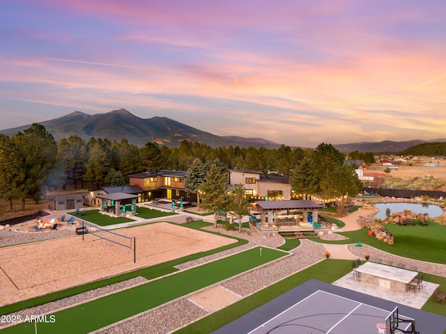 view of property's community featuring a mountain view, volleyball court, and basketball hoop