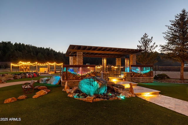 pool at dusk featuring a yard and a pergola