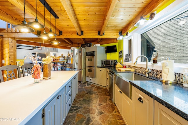 kitchen featuring appliances with stainless steel finishes, pendant lighting, sink, wooden ceiling, and beam ceiling