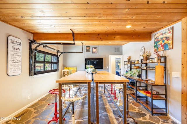 dining space with beamed ceiling and wooden ceiling