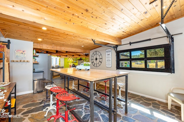 dining room with wood ceiling and beamed ceiling