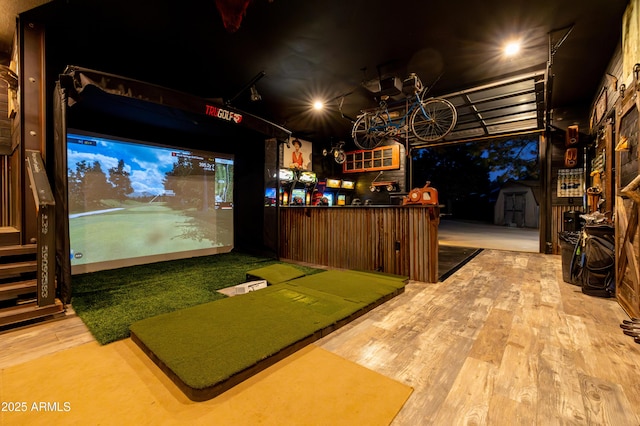 rec room with golf simulator and wood-type flooring