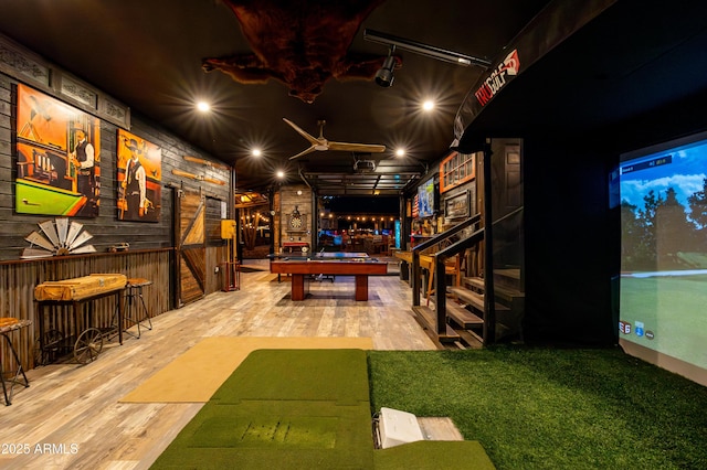 playroom with bar and hardwood / wood-style floors