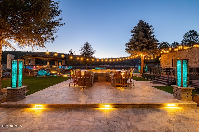 patio terrace at dusk with a bar