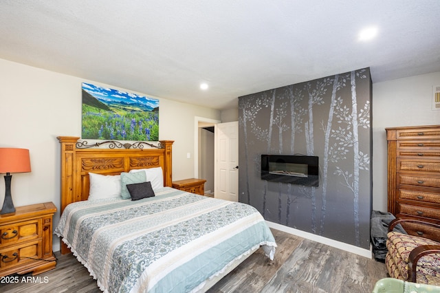 bedroom with dark hardwood / wood-style flooring