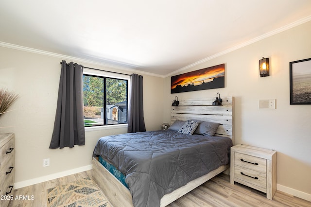 bedroom with light hardwood / wood-style flooring and ornamental molding