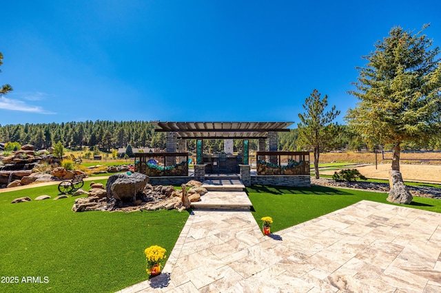 exterior space featuring a pergola and a patio area