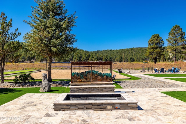 view of property's community featuring a patio area