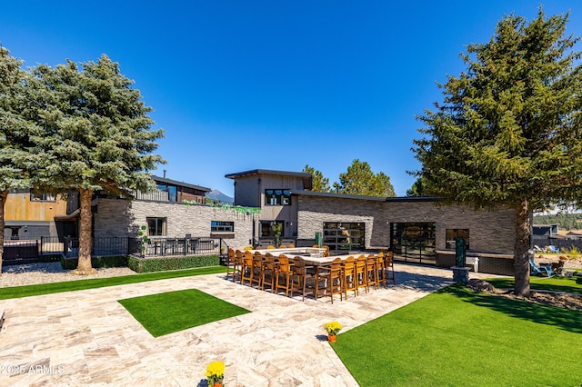 view of patio with exterior bar