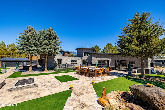 view of yard with an outdoor bar and a patio area