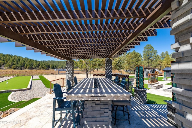 view of patio with a bar