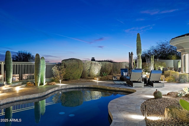 view of swimming pool with a patio, fence, and a fenced in pool