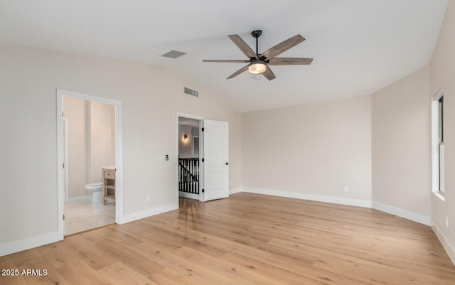 20929 N 37th Way, Phoenix, AZ 85050 - unfurnished bedroom with light wood-type flooring, vaulted ceiling, connected bathroom, and baseboards