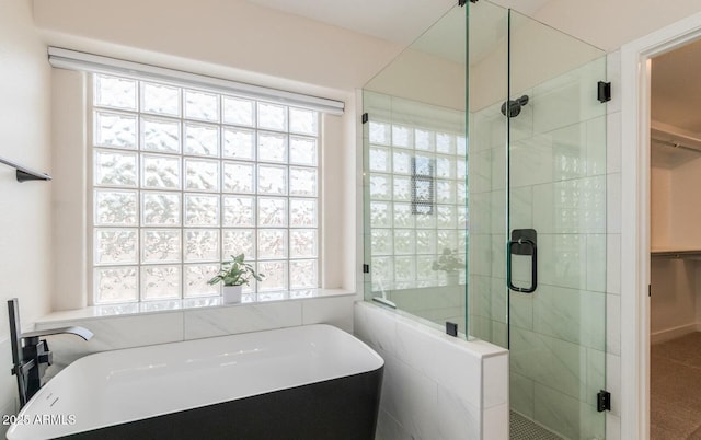 20929 N 37th Way, Phoenix, AZ 85050 - bathroom featuring a freestanding bath, a spacious closet, and a shower stall
