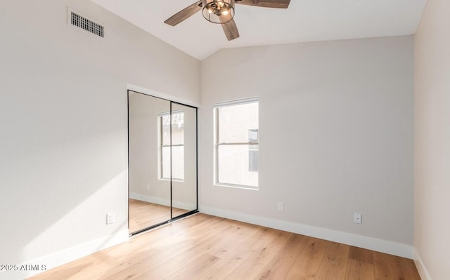 20929 N 37th Way, Phoenix, AZ 85050 - unfurnished bedroom with lofted ceiling, baseboards, light wood-style flooring, a closet, and ceiling fan