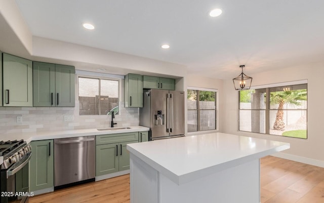 20929 N 37th Way, Phoenix, AZ 85050 - kitchen with green cabinets, appliances with stainless steel finishes, a sink, light countertops, and recessed lighting
