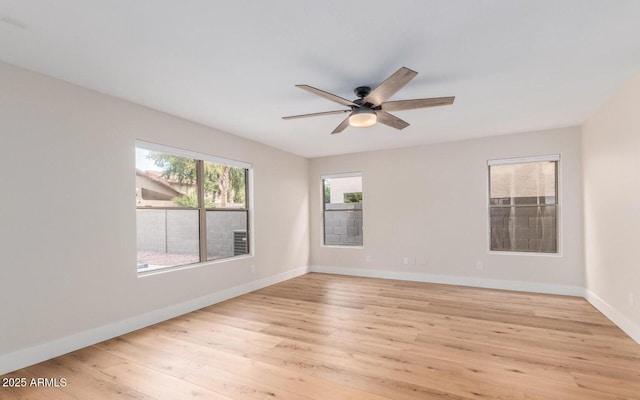 20929 N 37th Way, Phoenix, AZ 85050 - unfurnished room with light wood-type flooring, a ceiling fan, and baseboards