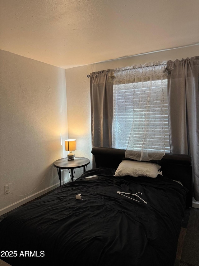 bedroom with baseboards