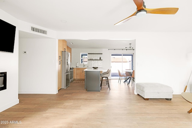 dining area featuring ceiling fan and light hardwood / wood-style flooring