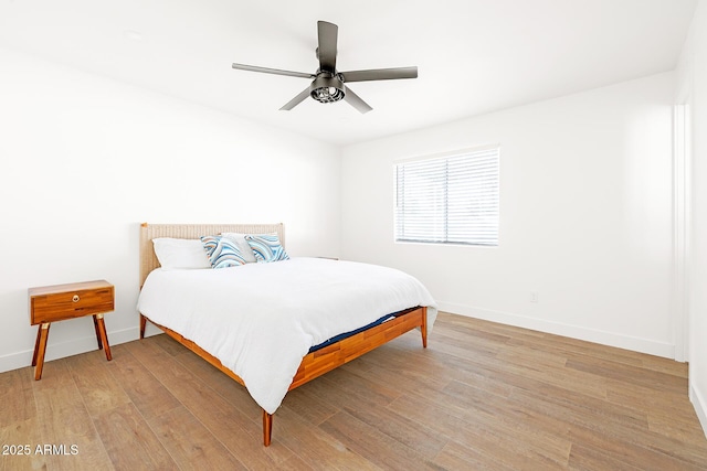 bedroom featuring light hardwood / wood-style floors and ceiling fan