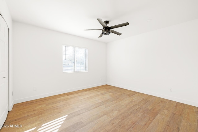 spare room with ceiling fan and light hardwood / wood-style floors