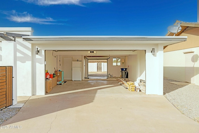 garage featuring white refrigerator