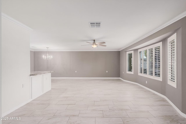 spare room with ceiling fan with notable chandelier and crown molding