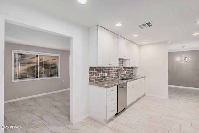 kitchen with white cabinets, sink, stone counters, a notable chandelier, and dishwasher