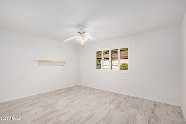 unfurnished room with ceiling fan