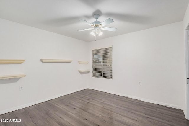 unfurnished room with ceiling fan and dark hardwood / wood-style flooring