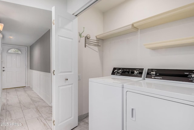 clothes washing area with washer and dryer