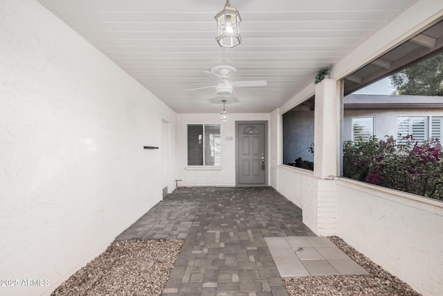 entrance to property featuring ceiling fan