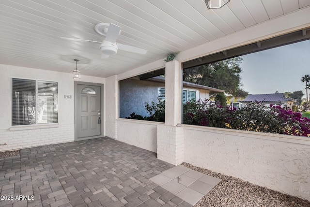 view of patio featuring ceiling fan