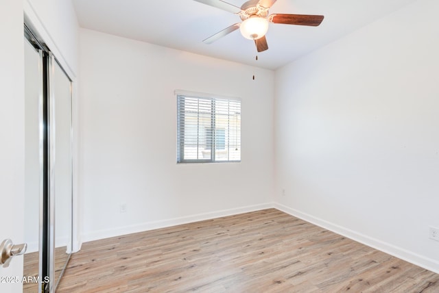 1367 S Country Club Dr S Unit 1125, Mesa, AZ 85210 - unfurnished bedroom with light wood-style flooring, a closet, and a ceiling fan