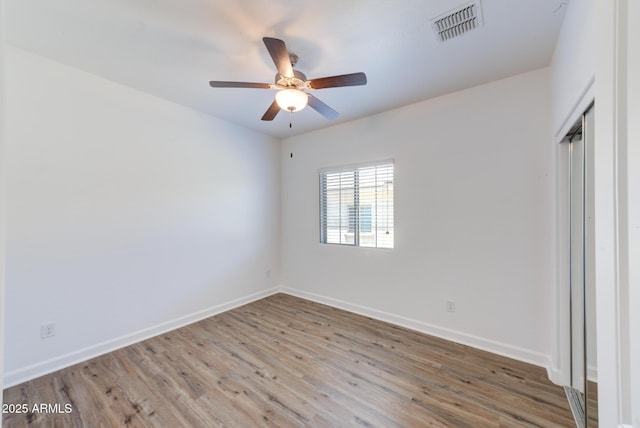 1367 S Country Club Dr S Unit 1125, Mesa, AZ 85210 - unfurnished room featuring wood finished floors and ceiling fan