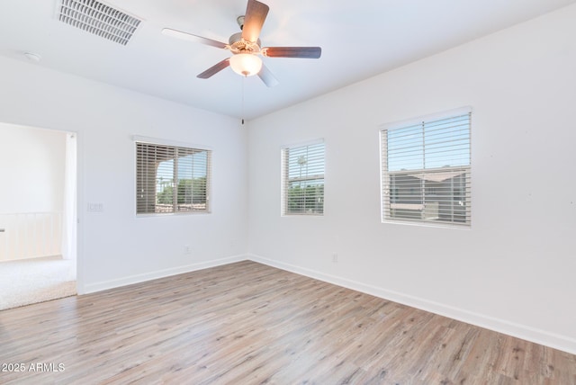 1367 S Country Club Dr S Unit 1125, Mesa, AZ 85210 - unfurnished room featuring wood finished floors and a ceiling fan