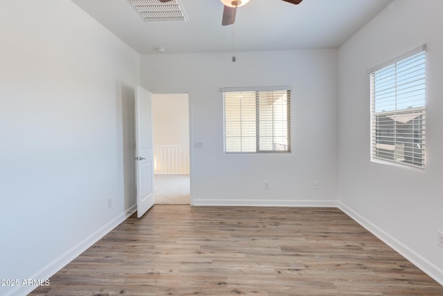 1367 S Country Club Dr S Unit 1125, Mesa, AZ 85210 - empty room featuring ceiling fan and wood finished floors