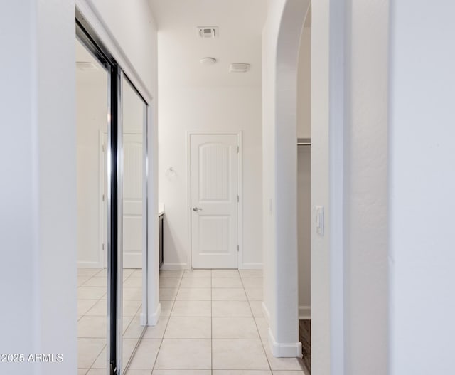 1367 S Country Club Dr S Unit 1125, Mesa, AZ 85210 - hall featuring arched walkways and light tile patterned floors