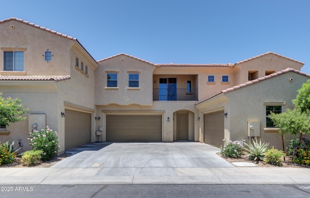 1367 S Country Club Dr S Unit 1125, Mesa, AZ 85210 - mediterranean / spanish home with a garage, stucco siding, a balcony, a tile roof, and driveway