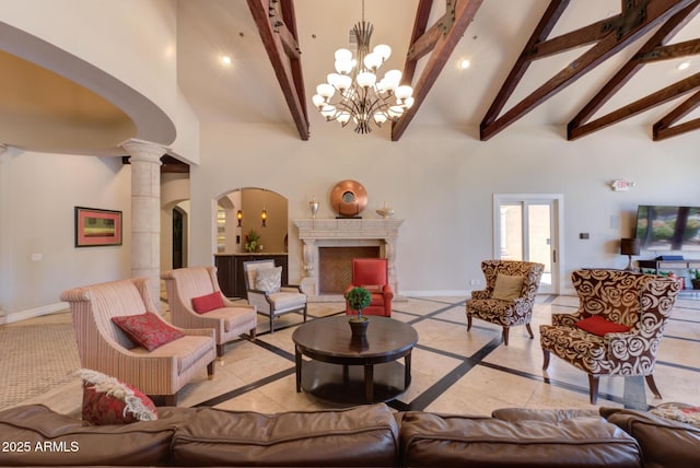 1367 S Country Club Dr S Unit 1125, Mesa, AZ 85210 - living room with inlaid floor details, high vaulted ceiling, arched walkways, beamed ceiling, and a chandelier