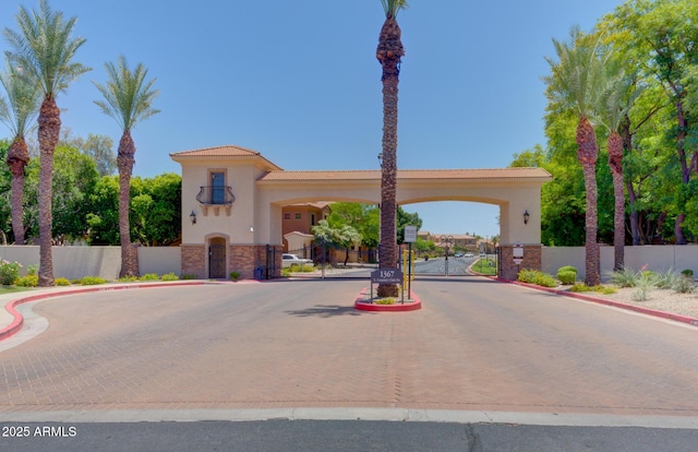 1367 S Country Club Dr S Unit 1125, Mesa, AZ 85210 - view of street featuring a gate, curbs, and a gated entry