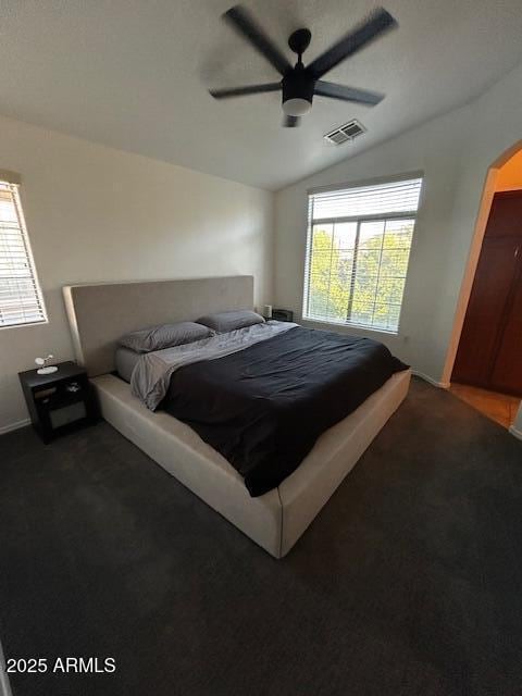 1350 S Greenfield Rd Unit 1219, Mesa, AZ 85206 - bedroom featuring vaulted ceiling, carpet floors, a ceiling fan, and arched walkways