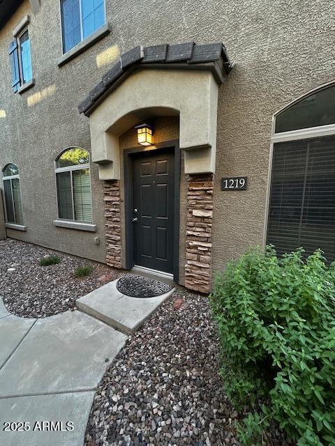 1350 S Greenfield Rd Unit 1219, Mesa, AZ 85206 - view of exterior entry with stucco siding